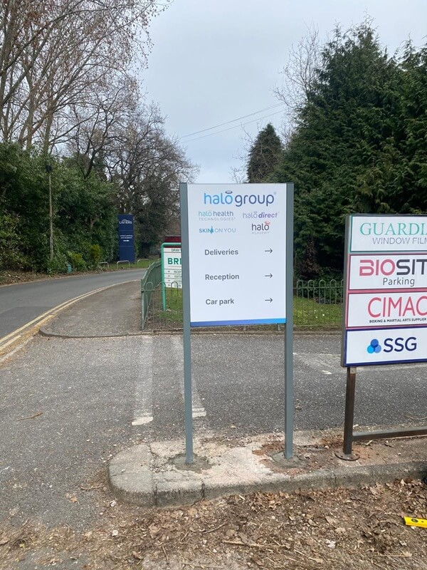 A photo of the freestanding halo health wayfinding signage on the road.